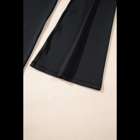 High-waisted crossover flared black leggings - Picture 9 of 10